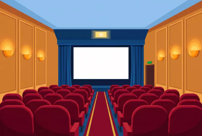 Illustration de la salle unique du cinéma de La Neuveville, ses fauteuils rouges et son écran encadré de rideaux